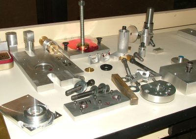 Shown here are some of the many fixtures that Tom had to make to complete several parts.
