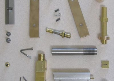 Pistol components which are weaved seamlessly into the all metal puzzle.