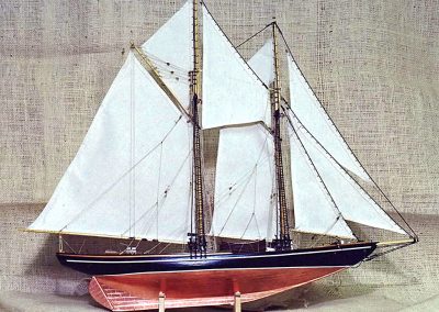 A fully rigged schooner with copper bottom.
