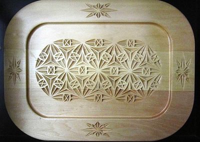 Another carved wooden plate, this time with a “diamonds and circles” pattern.