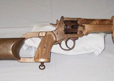 The Webley model includes an optional rifle stock and bayonet, which are attached to the pistol here.
