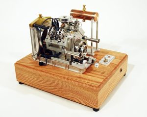 The finished Howell V-4 engine mounted to Craig's oak display stand.