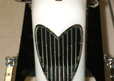 A tiny "moto-meter" temperature gauge is fitted in place on the radiator cap.