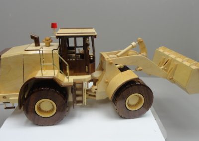 This Caterpillar loader features light and dark colored contrasting woods.