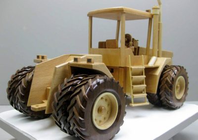 A wooden dual wheel tractor.