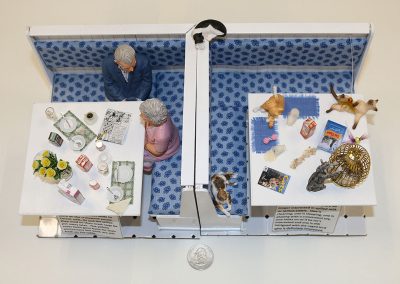 Peggy Boggeln’s 1/12 scale miniature, “Corner Tables” depicts an interesting breakfast scene.
