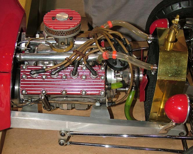 The scale Challenger engine installed in a hot rod model. 