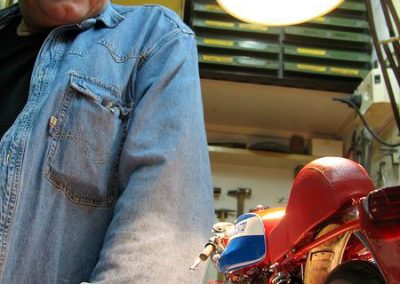 Pere stands with his finished scale model MV Agusta motorcycle.