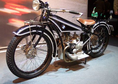 An original full-size BMW R32 motorcycle on display.