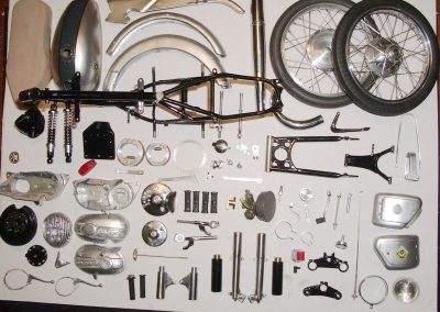 Disassembled components for the 1/5 scale Shrapnel 63 Bultaco.
