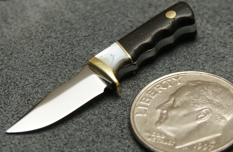 Brian's miniature fixed blade knife is hardly bigger than a dime. 