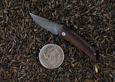 A custom miniature folding knife made by Brian Jacobson.