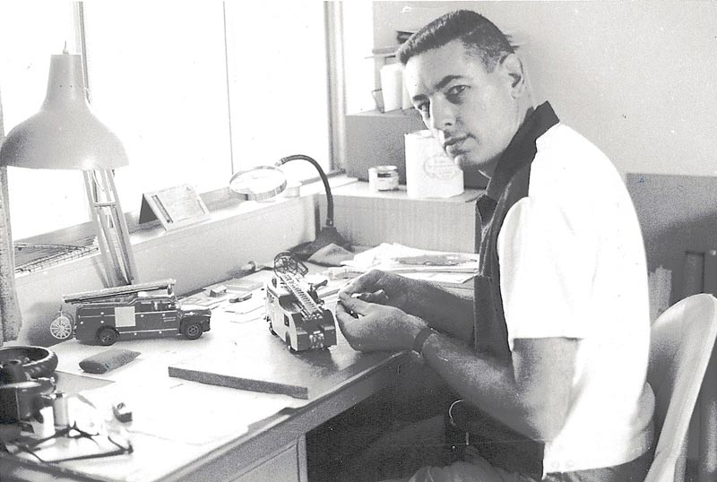 A young Tom Showers at work on a scale model ladder truck in 1966.