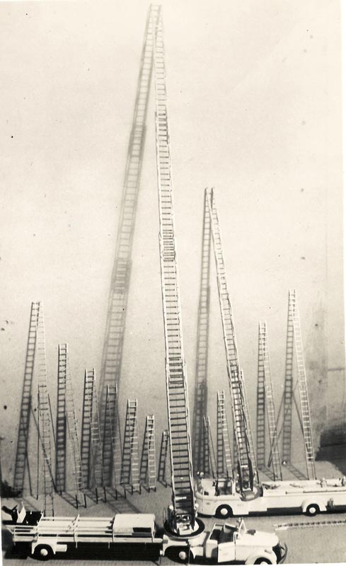 A display of two of Tom’s scale American LaFrance aerial ladder trucks in 1942.