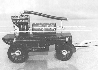 Tom’s scale replica of an 1830 Gooseneck style hand-drawn pumper. This was built early in Tom’s modeling career, and it’s possible that no color photos of this project exist. The model was made from balsa wood with wagon kit wheels.