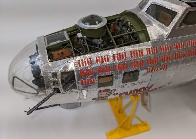 The 1/20 scale model airplane is complete down to the painted decals.