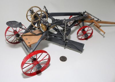 A scale model of an old Russell grader.
