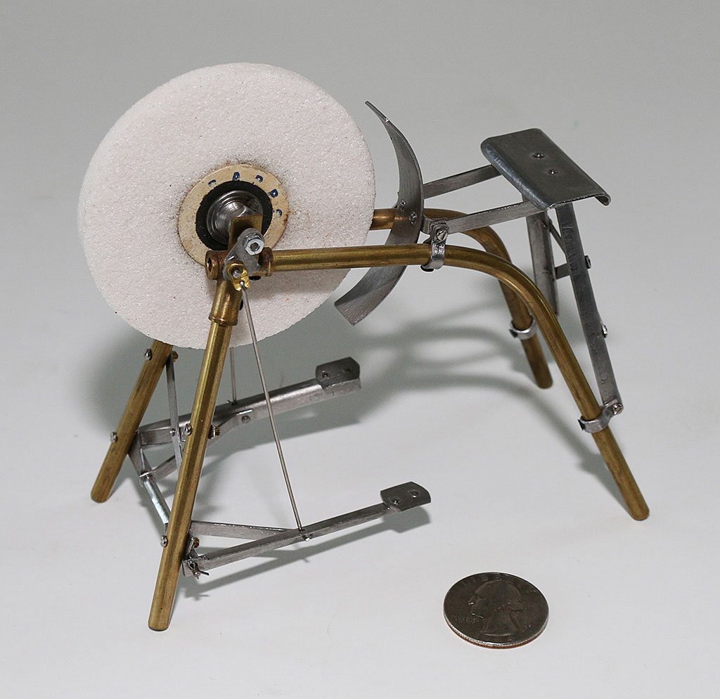 Birk’s miniature pedal-powered grinding wheel.