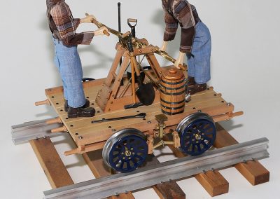 A model handcar that pumps up and down.