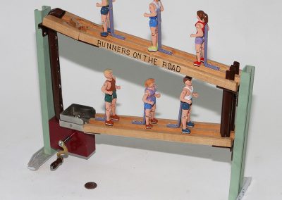 Birk's small mechanical toy, "Runners on the Road."