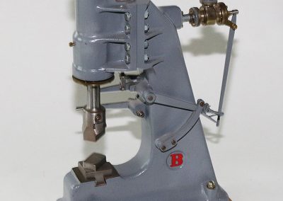 This heavy duty miniature is a model steam hammer.