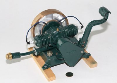 A vintage Maytag wash machine engine built in miniature.