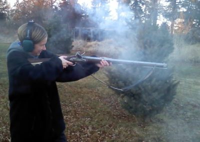 Clayton's wife, Amy firing the Baker rifle.