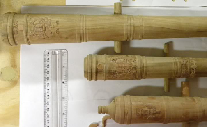 A ruler lends a sense of scale to the tiny decorative carvings on Clayton's cannons. 