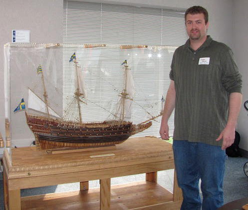 Clayton Johnson poses with his 1/50 scale model of the Swedish warship, Vasa.