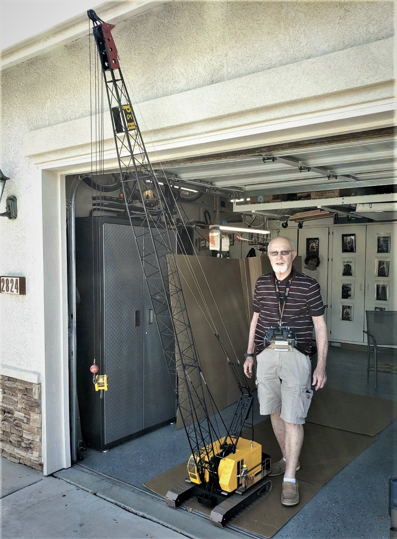 Thomas Garing stands with his 1/12 scale model P&H 1015 crawler lattice boom crane.