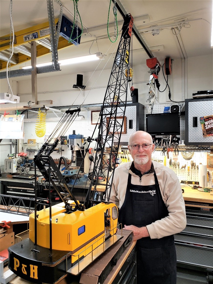 Tom Garing stands with his finished 1/12 scale P&H 1015 crane.
