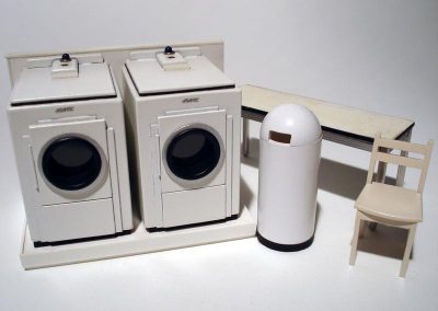 Scale model laundry machines for a tiny laundromat.