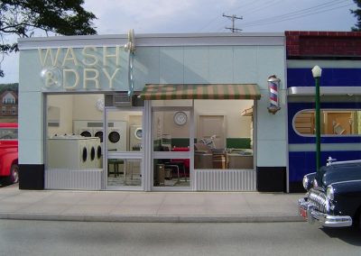 The Wash and Dry laundromat with barber shop next door.