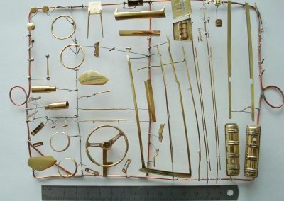 An array of brass parts ready for chroming.