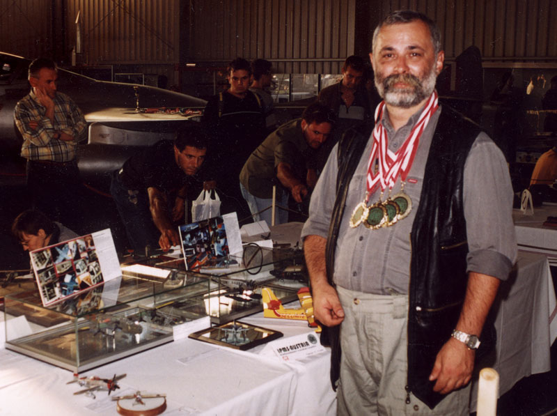 Andrzej wears the four gold medals he was awarded for his Junkers G-23 and Liberator models.