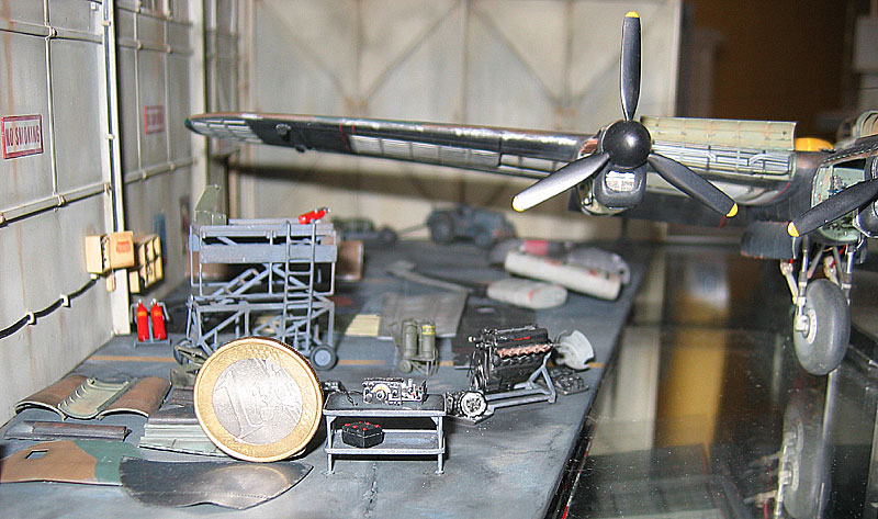 Some tiny scale aircraft components compared with a one Euro coin.