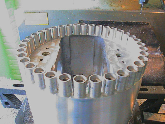 In this photo, 36 small Deltic pistons sit atop a full-size Paxman piston skirt
