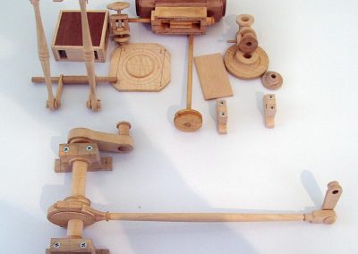 Several wooden parts for the drive mechanism.