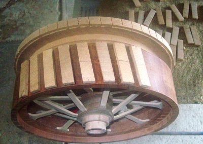 Shaped blocks were glued to the outside of the turned wheel to make the treads.