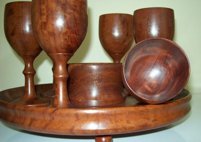 A set of wine goblets on a stand.