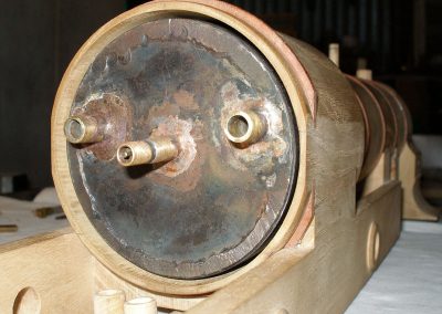 A metal "boiler" fits inside the wooden shell.