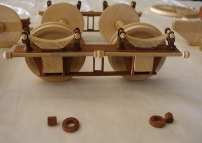 The assembled wooden truck with springs.