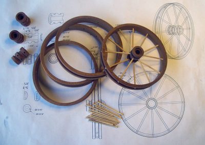 Components for the wooden spoked wheels were laid out before assembly.