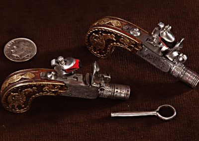 The intricate pocket pistols from the LeGrand set. 