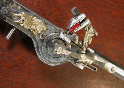 A close-up detail of the miniature wheel lock pistol combined with medieval mace. 