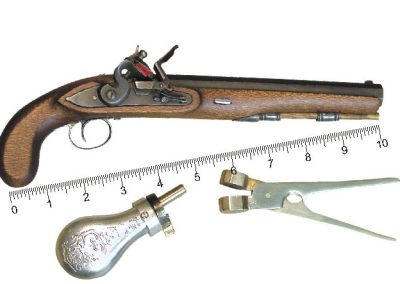 A miniature Wogdon flintlock pistol with accessories. 