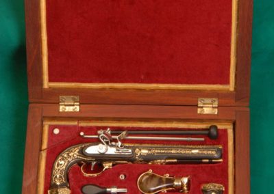 An ornate set of 1/3 scale Boutet dueling pistols.