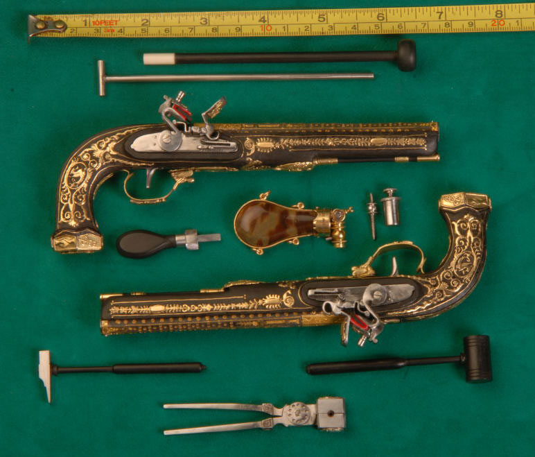 An ornate set of 1/3 scale Boutet dueling pistols. 