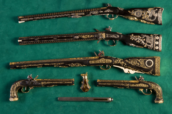 A collection of Antonio's miniature Boutet carbines and dueling pistols.