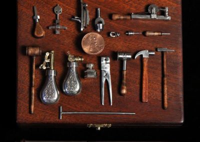 A miniature boxed set of gunsmithing tools